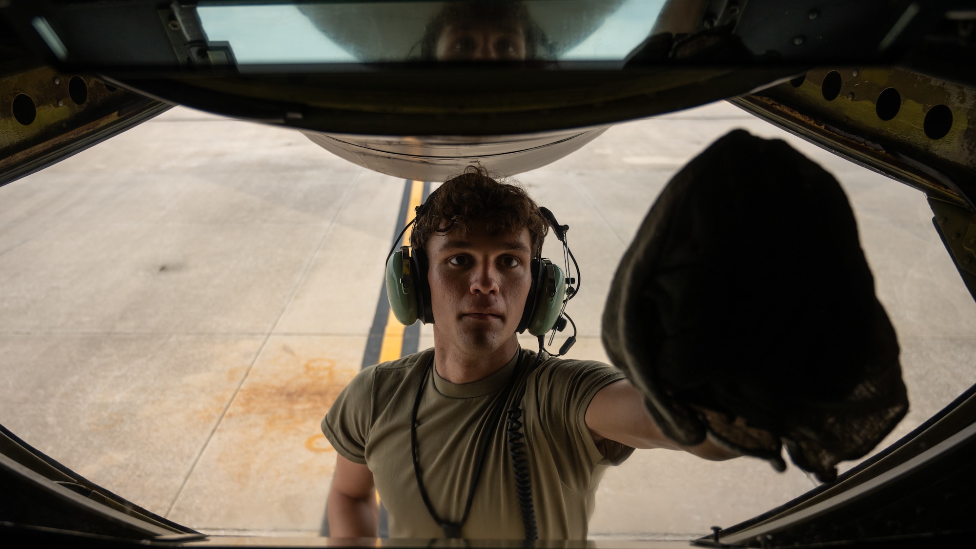 A crew chief assigned to the 6th Aircraft Maintenance Squadron cleans the boom pod window on a KC-135 Stratotanker before flight Sept. 12, 2025, at MacDill Air Force Base, Florida. Crew chiefs perform thorough pre-flight inspections of an aircraft’s exterior, checking for leaks, hydraulic issues, and structural integrity before every mission. The dedication of AMC Airmen ensures every tanker launches ready, fueling the mission and the fighters who depend on it. (U.S. Air Force photo by Tech. Sgt. Alexander Cook)