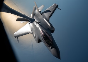 A U.S. Air Force F-35A Lightning II assigned to the 6th Weapons Squadron receives fuel from a KC-135 Stratotanker assigned to the 91st Air Refueling Squadron during exercise Combat Archer, Sept. 12, 2025, over the Gulf of America. Combat Archer provides the 6th Air Refueling Wing an opportunity to integrate with fighter units during live-fire air-to-air weapons evaluations. With rapid, reliable refueling, AMC tankers extend sorties and sustain combat operations, allowing fighters to concentrate on weapons employment and underscoring air mobility as a critical enabler of readiness. (U.S. Air Force photo by Tech. Sgt. Alexander Cook)