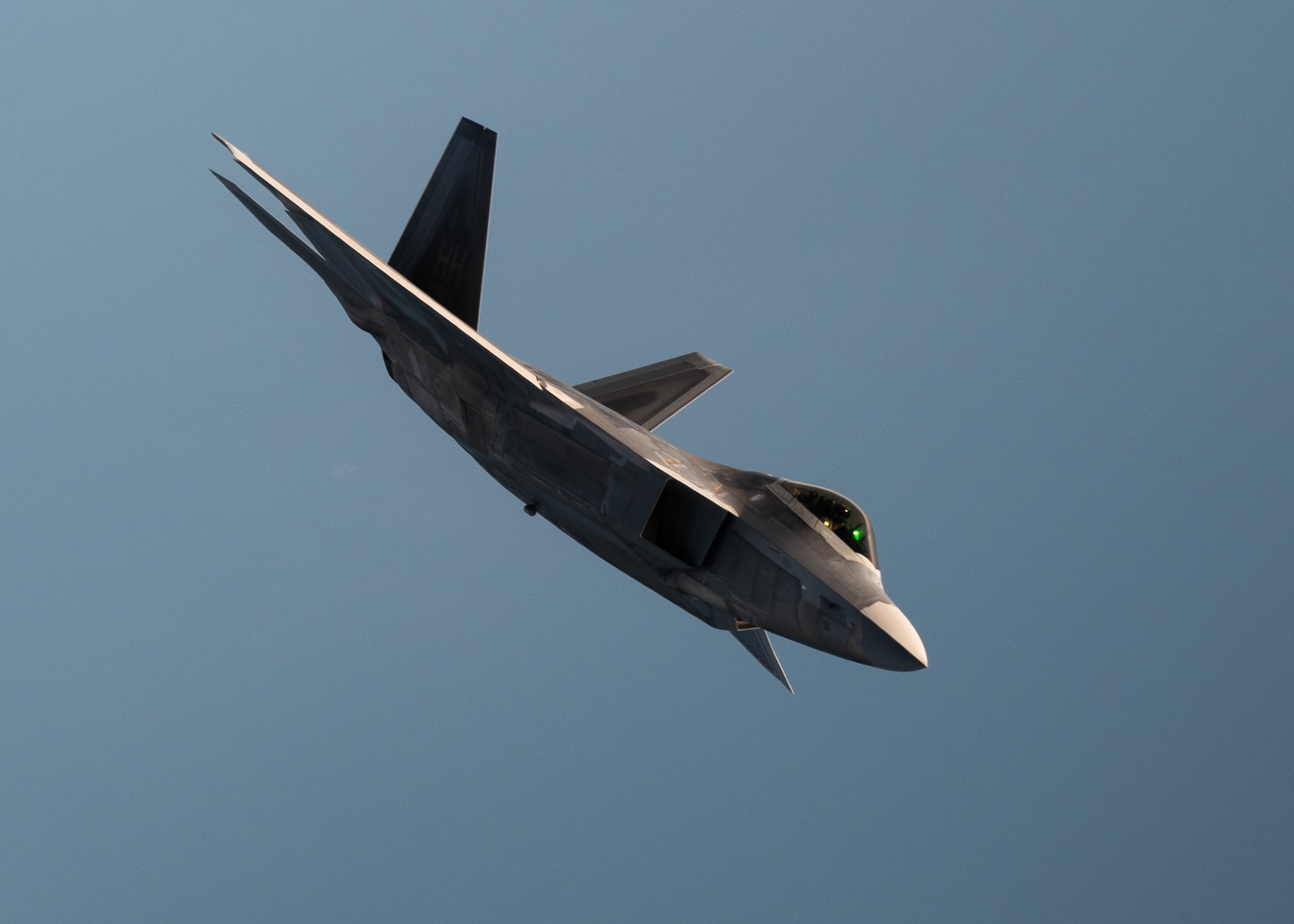 A U.S. Air Force F-22 Raptor assigned to the 433rd Weapons Squadron banks left after receiving fuel from a KC-135 Stratotanker assigned to the 91st Air Refueling Squadron during exercise Combat Archer, Sept. 12, 2025, over the Gulf of America. Combat Archer provides the 6th Air Refueling Wing an opportunity to integrate with fighter units during live-fire air-to-air weapons evaluations. With rapid, reliable refueling, AMC tankers extend sorties and sustain combat operations, allowing fighters to concentrate on weapons employment and underscoring air mobility as a critical enabler of readiness. (U.S. Air Force photo by Tech. Sgt. Alexander Cook)