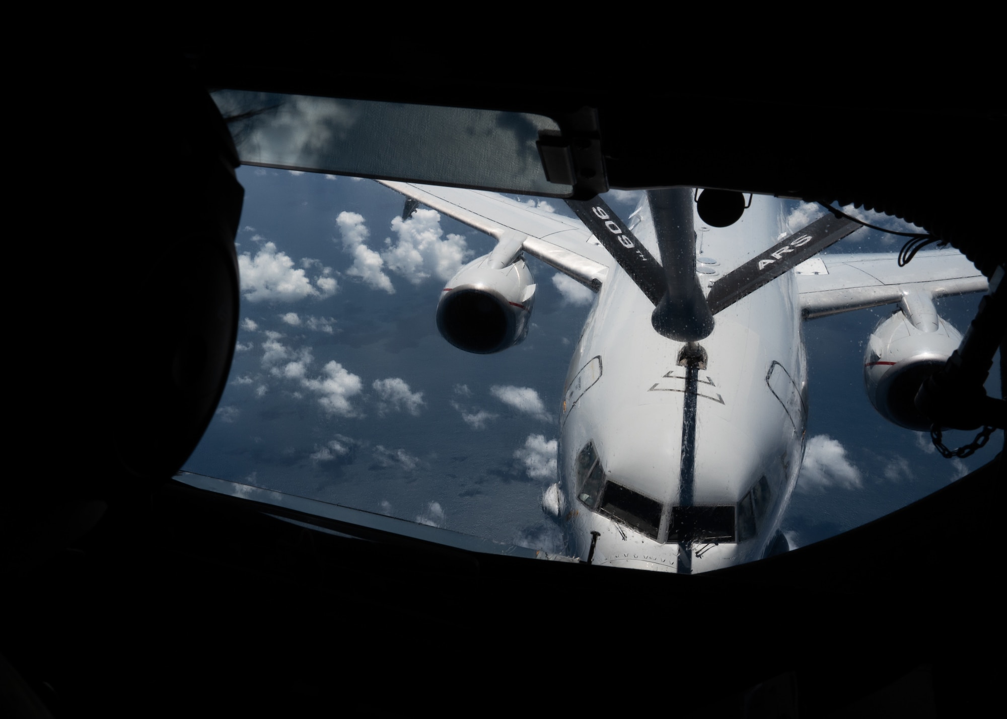 A KC-135 Stratotanker refuels a U.S. Navy aircraft.