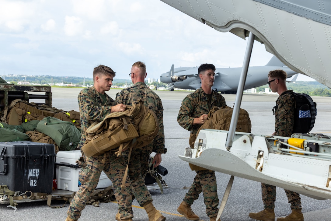 U.S. Marines with 3D Marine Expeditionary Brigade load cargo from a 463L master pallet onto a KC-130J Super Hercules during an Alert Contingency Marine Air-Ground Task Force (ACM) drill in preparation for exercise Resolute Dragon 25 at Kadena Air Base, Okinawa, Japan, Sept. 11, 2025. An ACM drill is a rapid-reaction training exercise to maintain a ready force that can deploy immediately in response to crisis. RD25 is an annual bilateral exercise in Japan that strengthens the command, control, and multi-domain maneuver capabilities of Marines in III Marine Expeditionary Force and allied Japan Self-Defense Force personnel.  (U.S. Marine Corps photo by Sgt. Nicholas A. Cox)
