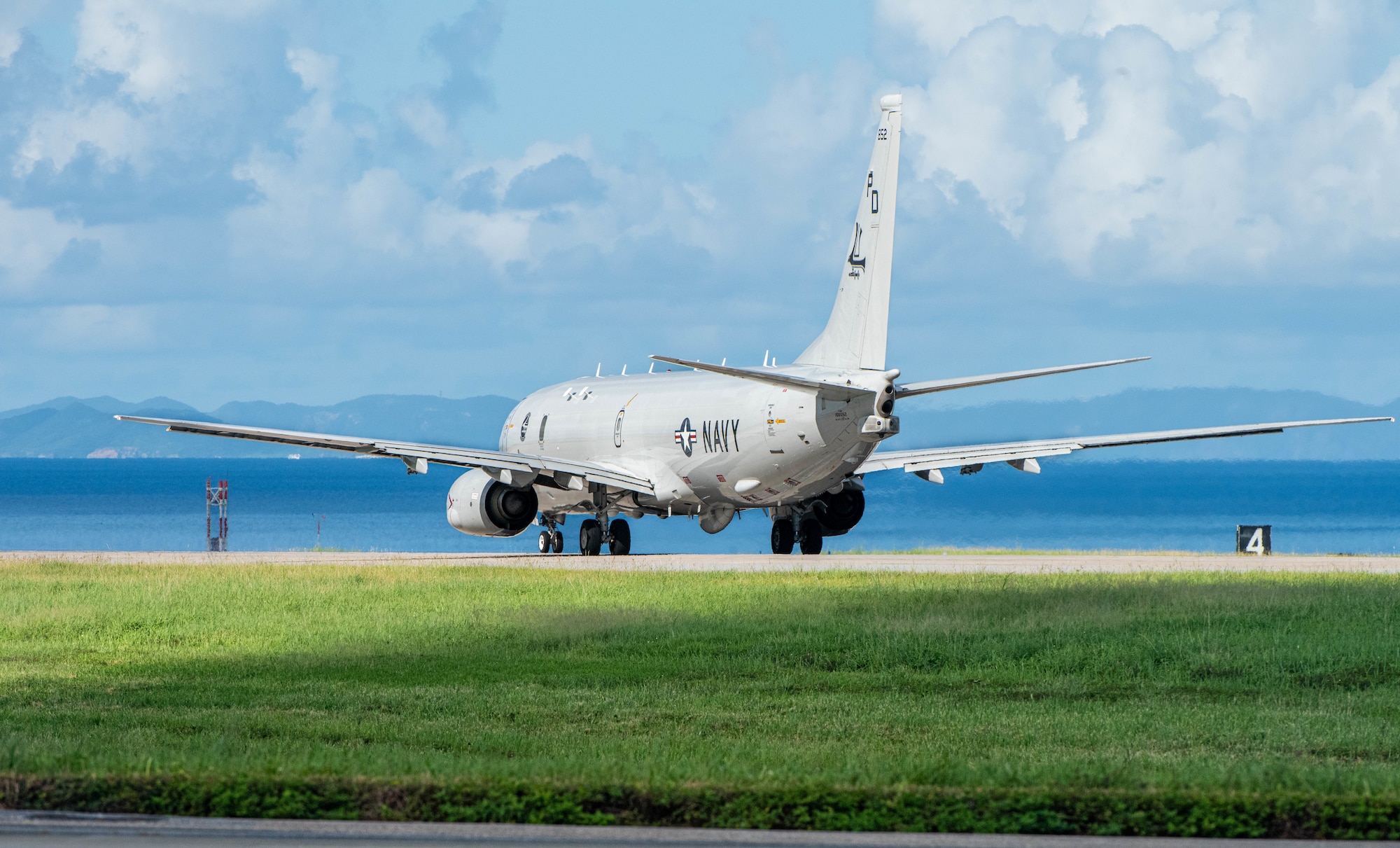 A U.S. Naval aircraft taxis down the flightline.
