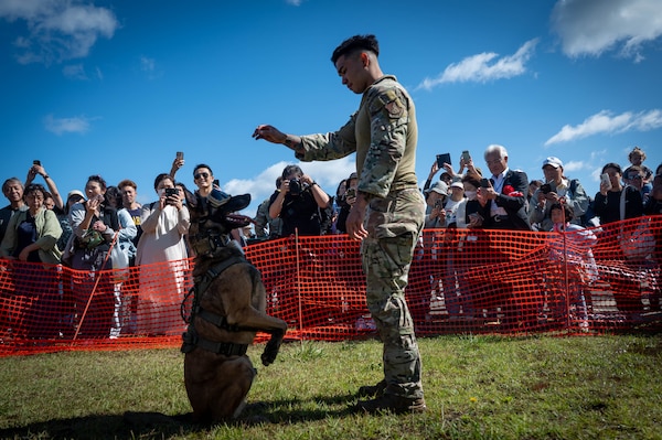 A K9 handler assigned to the 35th Security Forces Squadron performs a demonstration during Air Fest 2025 at Misawa Air Base, Japan, Sept. 21, 2025.