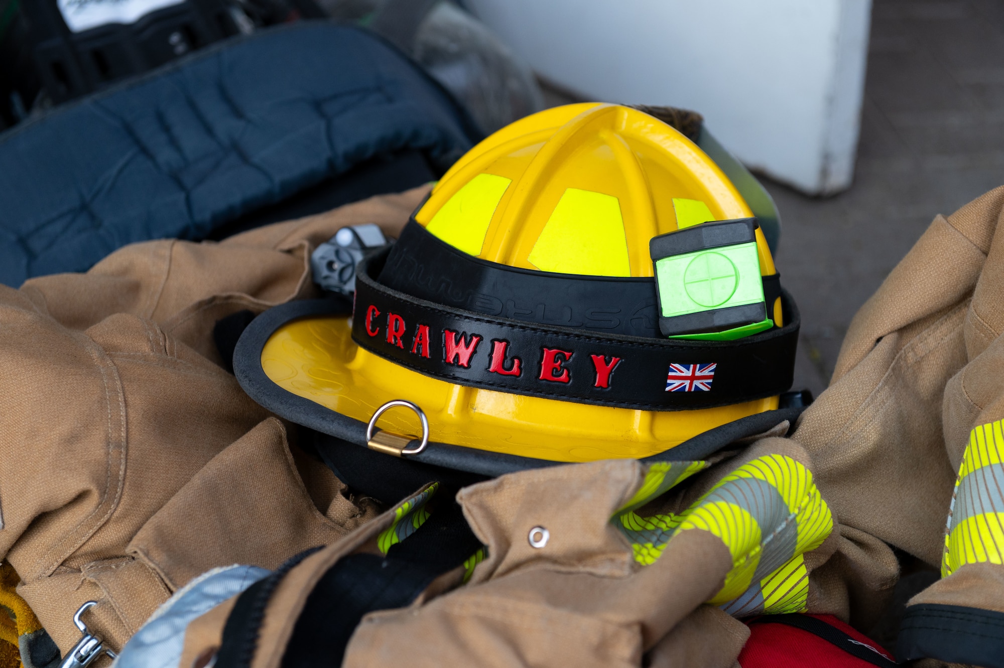 A U.S. Air Force firefighter helmet that belongs to the 100th Civil Engineer Squadron sits on top of gear during the 9/11 Memorial Climb at RAF Mildenhall, England, Sept. 11, 2025.