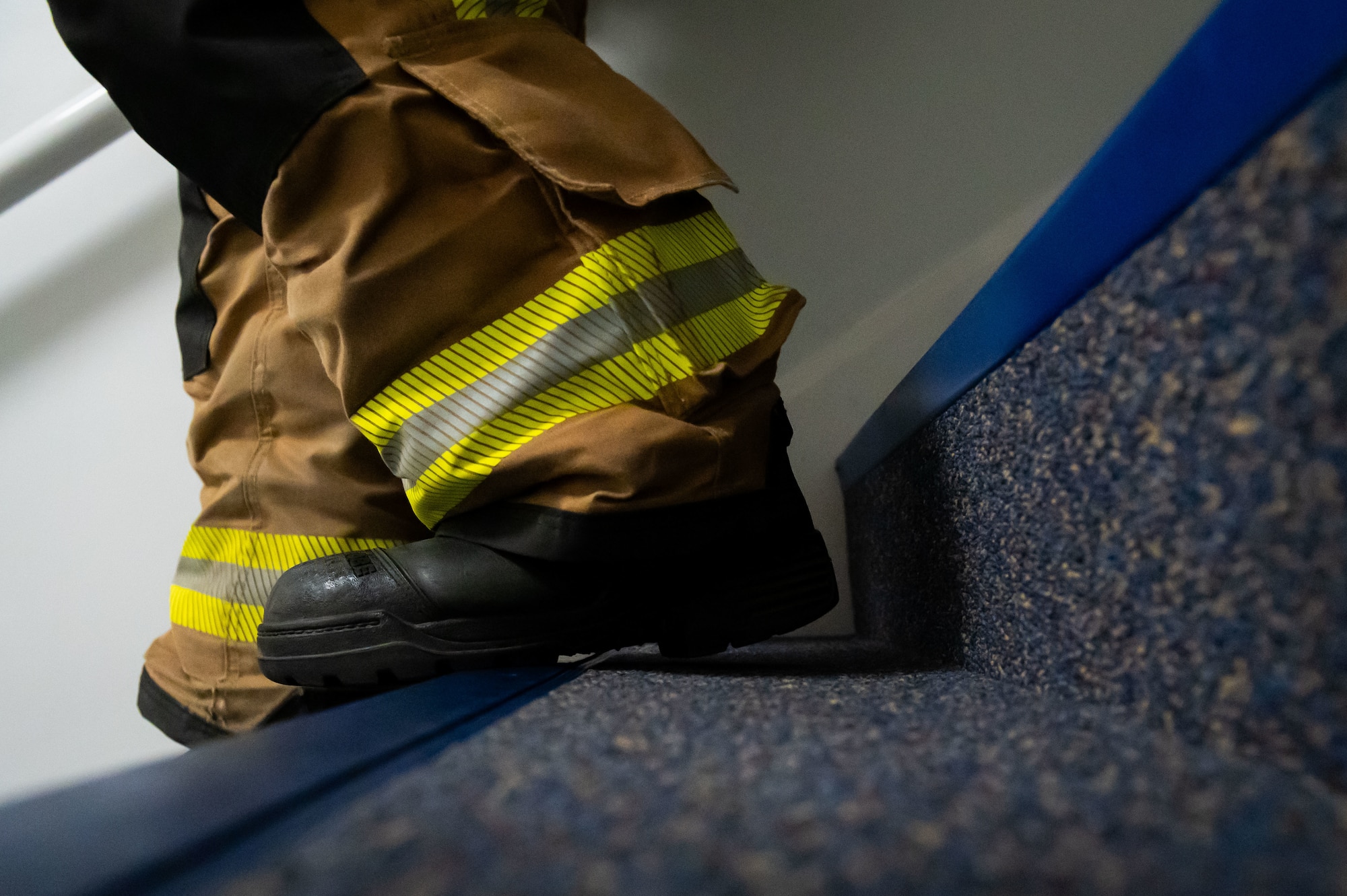 A U.S. Air Force Airman assigned to the 100th Civil Engineer Squadron descends the stairwell of the air traffic control tower during the 9/11 Memorial Climb on RAF Mildenhall, England, Sept. 11, 2025.