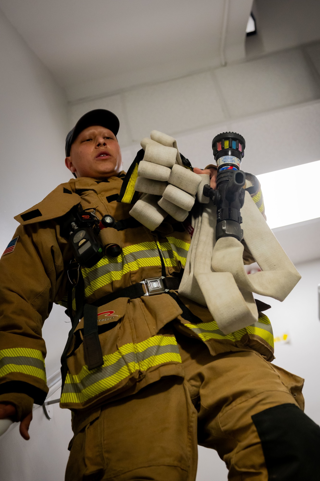 U.S. Air Force Senior Airman Timothy Islas, 100th Civil Engineer Squadron firefighter, descends the stairwell of the air traffic control tower during the 9/11 Memorial Climb on RAF Mildenhall, England, Sept. 11, 2025.