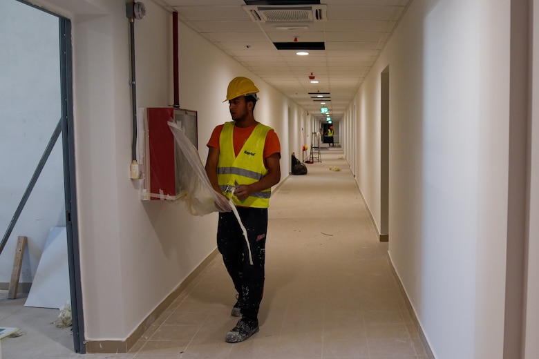 two men working in a hallway