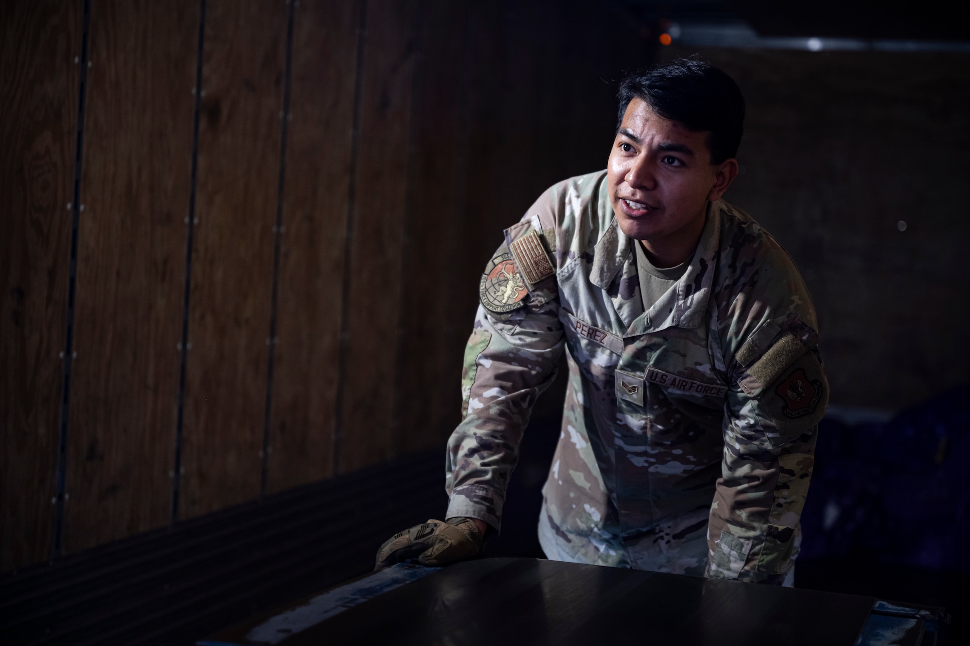 U.S. Air Force Senior Airman Christopher Perez, 100th Force Support Squadron postal clerk, extends the conveyor belt before unloading a mail delivery at RAF Mildenhall, England, Sept. 19, 2025.