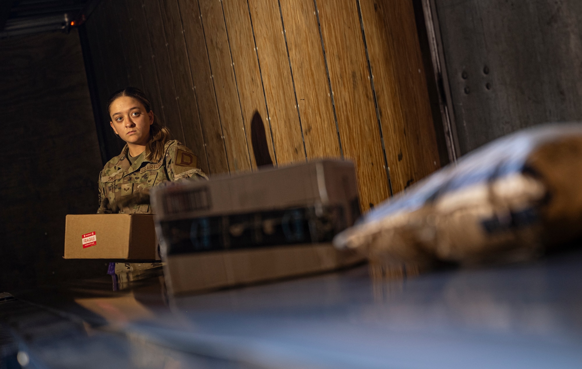 U.S. Air Force Senior Airman MacKinley Smith, 100th Force Support Squadron postal clerk, sorts packages after a mail delivery at RAF Mildenhall, England, Sept. 19, 2025.