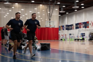 Personnel from Berkeley Township Police Department and Toms River Police Department compete against each other during the 87th Force Support Squadron’s 1st Annual Lakehurst Fitness Day Challenge at Joint Base McGuire-Dix-Lakehurst, N.J., Sept. 17, 2025. The 87th FSS event challenged several off-base police departments to complete a series of exercises, fostering collaboration with our mission partners. (U.S. Air Force Senior Airman Aidan Thompson)