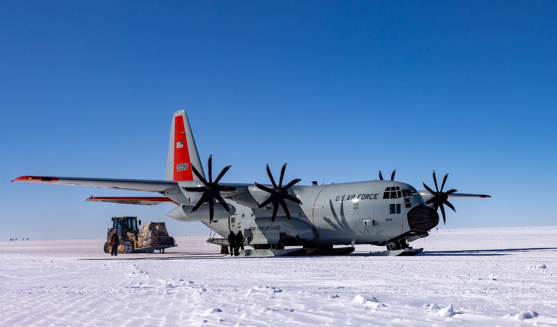 An LC-130 Hercules aircraft from the 109th Airlift Wing is being unloaded at Summit Station, Greenland, May 9, 2024.