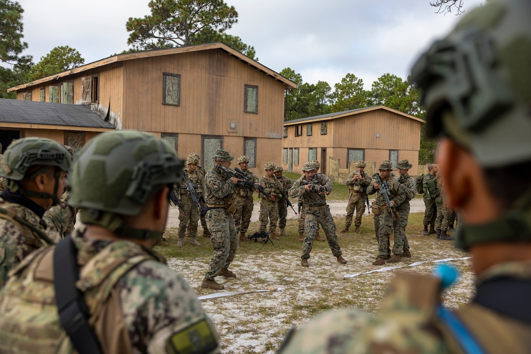 U.S. Marines with 2nd Battalion, 2nd Marine Regiment, demonstrate how they conduct room clearing while participating in urban operations training during exercise UNITAS 2025 at Marine Corps Base Camp Lejeune, North Carolina, Sept. 18, 2025. UNITAS, which is Latin for “unity,” was conceived in 1959 and has taken place annually since first conducted in 1960. This year marks the 66th iteration of the world’s longest-running annual multinational maritime exercise. (U.S. Marine Corps photo by Lance Cpl. Payton Goodrich)