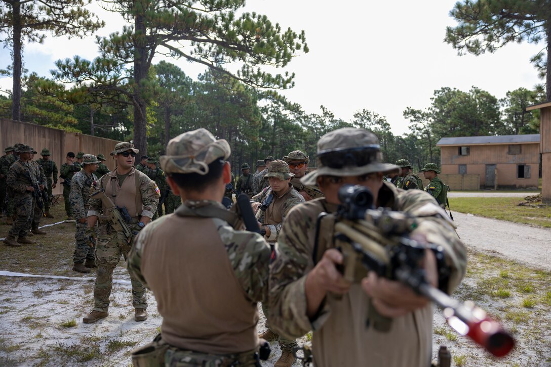 Cuerpo de Infantería de Marina (Chilean marine corps) conduct urban operations training during exercise UNITAS 2025 at Marine Corps Base Camp Lejeune, North Carolina, Sept. 18, 2025. UNITAS, which is Latin for “unity,” was conceived in 1959 and has taken place annually since first conducted in 1960. This year marks the 66th iteration of the world’s longest-running annual multinational maritime exercise. (U.S. Marine Corps photo by Lance Cpl. Payton Goodrich)