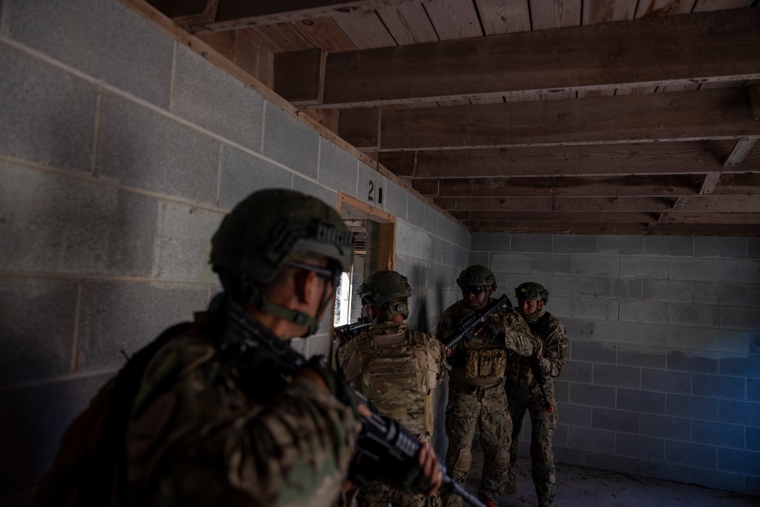 Marines with Infantería de Marina de la Armada de la República Argentina (naval infantry of the Argentine navy), and Marines with Infantería de Marina Colombiana (Colombian marines) participate in urban operations training during exercise UNITAS 2025 at Marine Corps Base Camp Lejeune, North Carolina, Sept. 18, 2025. UNITAS, which is Latin for “unity,” was conceived in 1959 and has taken place annually since first conducted in 1960. This year marks the 66th iteration of the world’s longest-running annual multinational maritime exercise. (U.S. Marine Corps photo by Lance Cpl. Payton Goodrich)