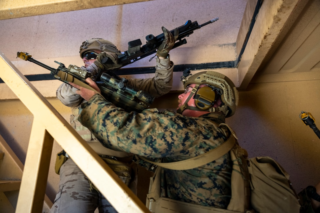 U.S. Marine Corps Lance Cpl. Beau Rash, a rifleman with 2nd Battalion, 2nd Marine Regiment, and Soldado Pablo Faus a marine with Infantería de Marina (Spanish marine corps), clear the top floor of a house while participating in urban operations drills, during exercise UNITAS 2025 at Marine Corps Base Camp Lejeune, North Carolina, Sept. 18, 2025. UNITAS, which is Latin for “unity,” was conceived in 1959 and has taken place annually since first conducted in 1960. This year marks the 66th iteration of the world’s longest-running annual multinational maritime exercise. (U.S. Marine Corps photo by Lance Cpl. Payton Goodrich)
