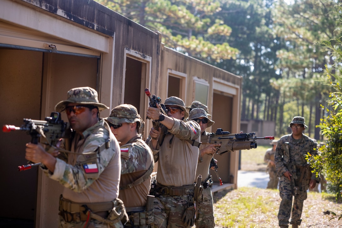 Marines with Cuerpo de Infantería de Marina (Chilean marine corps) practice urban terrain training during exercise UNITAS 2025 at Marine Corps Base Camp Lejeune, North Carolina, Sept. 19, 2025. UNITAS, which is Latin for “unity,” was conceived in 1959 and has taken place annually since first conducted in 1960. This year marks the 66th iteration of the world’s longest running annual multinational maritime exercise. (U.S. Marine Corps photo by Lance Cpl. Payton Goodrich)