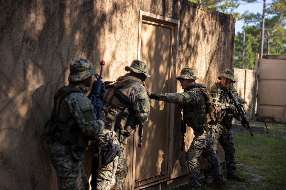 Marines with Infantería de Marina Colombiana (Colombian marines) prepare to breach a door while conducting urban terrain training during exercise UNITAS 2025 at Marine Corps Base Camp Lejeune, North Carolina, Sept. 19, 2025. UNITAS, which is Latin for “unity,” was conceived in 1959 and has taken place annually since first conducted in 1960. This year marks the 66th iteration of the world’s longest running annual multinational maritime exercise. (U.S. Marine Corps photo by Lance Cpl. Payton Goodrich)