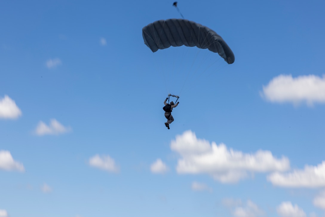 A U.S. Marine with 3rd Force Reconnaissance Company, 4th Marine Division, parachutes from an MV-22B Osprey tiltrotor aircraft during sustainment jumps during exercise UNITAS 2025 at Marine Corps Base Camp Lejeune, North Carolina, Sept. 20, 2025. UNITAS, which is Latin for “unity,” was conceived in 1959 and has taken place annually since first conducted in 1960. This year marks the 66th iteration of the world’s longest running annual multinational maritime exercise. (U.S. Marine Corps photo by Lance Cpl. Payton Goodrich)