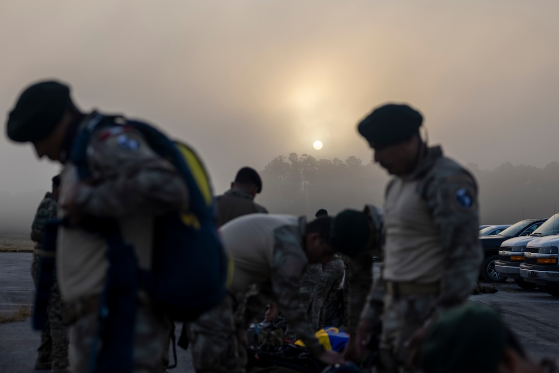 Marines with Infantería de Marina del Perú (Peruvian naval infantry) prepare their parachutes before participating in sustainment jumps during exercise UNITAS 2025 at Marine Corps Base Camp Lejeune, North Carolina, Sept. 20, 2025. UNITAS, which is Latin for “unity,” was conceived in 1959 and has taken place annually since first conducted in 1960. This year marks the 66th iteration of the world’s longest running annual multinational maritime exercise. (U.S. Marine Corps photo by Lance Cpl. Payton Goodrich)