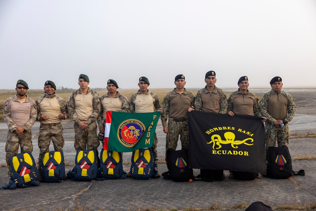 Marines with Infantería de Marina del Perú (Peruvian naval infantry) and marines with Cuerpo de Infantería de Marina (Ecuadorian marines) pose for a group photo before participating in sustainment jumps during exercise UNITAS 2025 at Marine Corps Base Camp Lejeune, North Carolina, Sept. 20, 2025. UNITAS, which is Latin for “unity,” was conceived in 1959 and has taken place annually since first conducted in 1960. This year marks the 66th iteration of the world’s longest running annual multinational maritime exercise. (U.S. Marine Corps photo by Lance Cpl. Payton Goodrich)