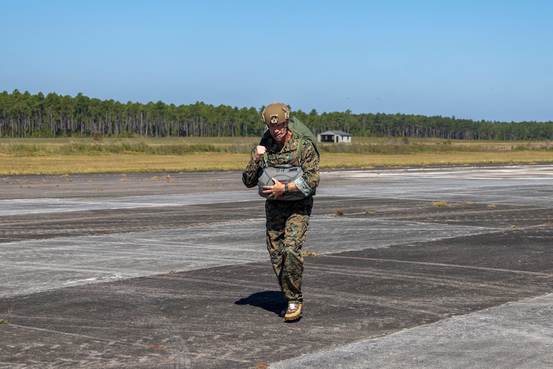 U.S. Marine Corps Brig. Gen. Kevin Jarrard, the commanding general of 4th Marine Division, runs back to the staging area after conducting a sustainment jump from an MV-22B Osprey tiltrotor aircraft during exercise UNITAS 2025 at Marine Corps Base Camp Lejeune, North Carolina, Sept. 20, 2025. UNITAS, which is Latin for “unity,” was conceived in 1959 and has taken place annually since first conducted in 1960. This year marks the 66th iteration of the world’s longest running annual multinational maritime exercise. (U.S. Marine Corps photo by Lance Cpl. Payton Goodrich)