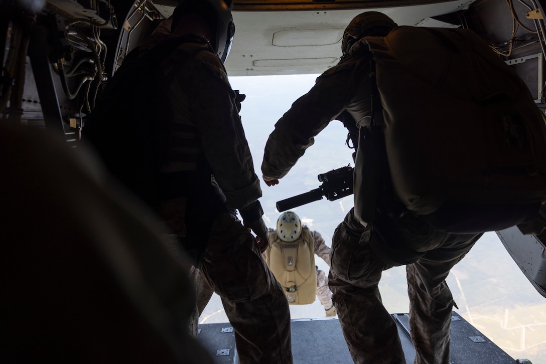 U.S. Marines with 3rd Force Reconnaissance Company, 4th Marine Division, and marines with Infantería de Marina del Perú (Peruvian naval infantry) and marines with Cuerpo de Infantería de Marina (Ecuadorian marines) jump from an MV-22B Osprey tiltrotor aircraft, assigned to Marine Medium Tiltrotor Squadron (VMM) 261, at 10,000 feet while conducting sustainment jumps during exercise UNITAS 2025 at Marine Corps Base Camp Lejeune, North Carolina, Sept. 20, 2025. UNITAS, which is Latin for “unity,” was conceived in 1959 and has taken place annually since first conducted in 1960. This year marks the 66th iteration of the world’s longest running annual multinational maritime exercise. (U.S. Marine Corps photo by Lance Cpl. Payton Goodrich)