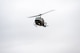 A UH-1 Iroquois assigned to the 54th Helicopter Squadron flies over Sentinel Stadium for the Minot North High School football game in Minot, North Dakota, Sept. 20, 2025. Team Minot leadership delivered the game ball as part of the pre-game ceremonies highlighting the partnership between Team Minot and the local community. (U.S. Air Force photo by Senior Airman Luis Gomez)