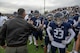 Col. Jesse Lamarand, 5th Bomb Wing commander, fist bumps a Minot North High School football player before the homecoming game at Minot, North Dakota, Sept. 20, 2025. Leadership from the 5th BW and 91st Missile Wing took part in pre-game activities to honor the community and kick off the game. (U.S. Air Force photo by Senior Airman Luis Gomez)