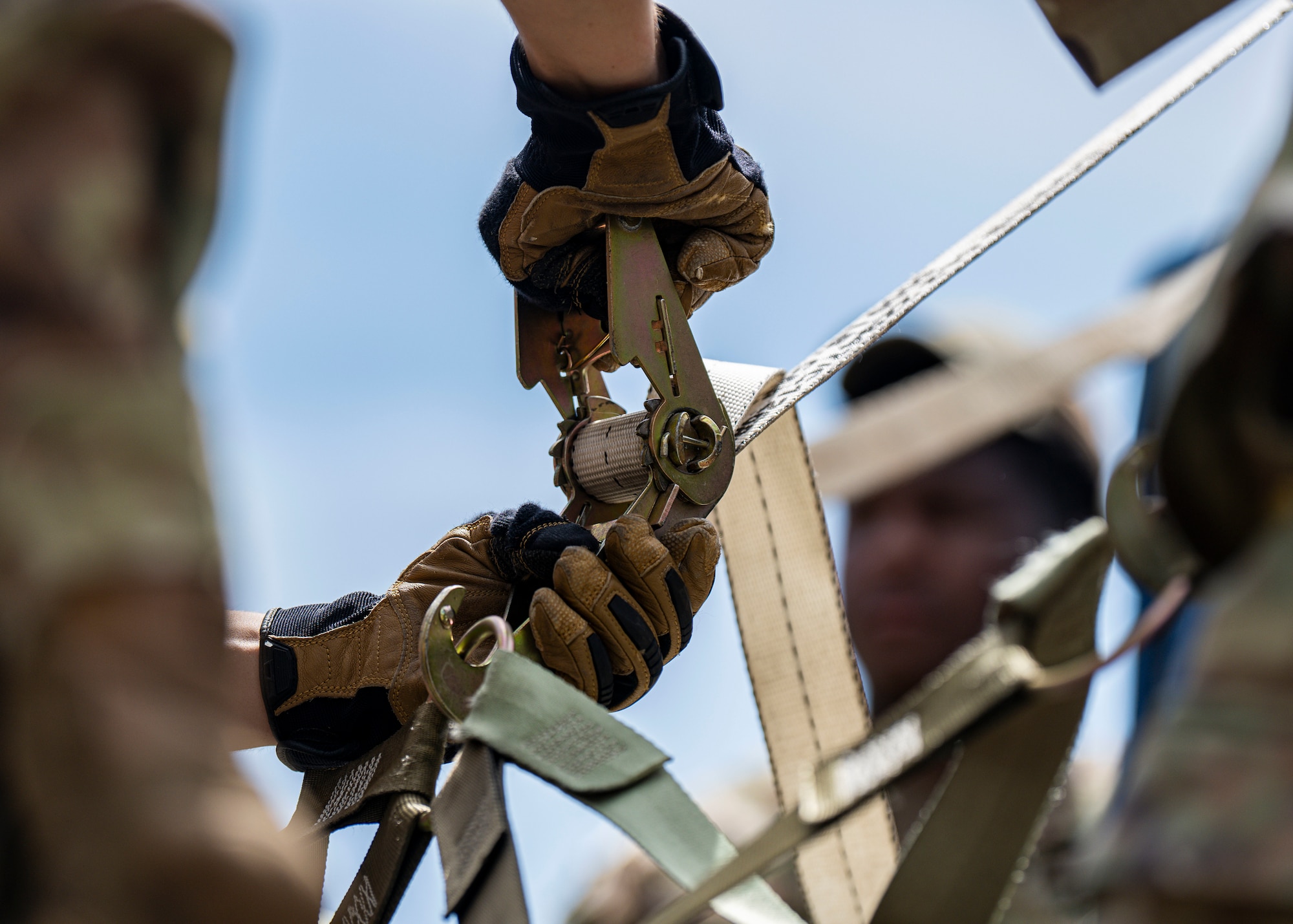 A U.S. Airman assigned to the 1st Special Operations Wing secures equipment on a pallet during Mission Ready Airmen Training