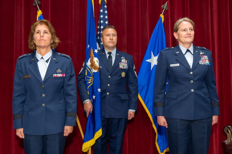 U.S. Air Force Lt. Gen. Andrea D. Tullos, commander and president of Air University, presents the Air War College guidon to the incoming AWC commander, U.S. Air Force Brig. Gen. Jocelyn Schermerhorn at Maxwell Air Force Base, Alabama, Sept. 2, 2025. The Air War College consists of the Air Force’s premier officer professional military education institutions, including the Air War College, Air Command and Staff College, the School for Advanced Air and Space Studies, and the International Officer School. (U.S. Air Force photo by Trey Ward)