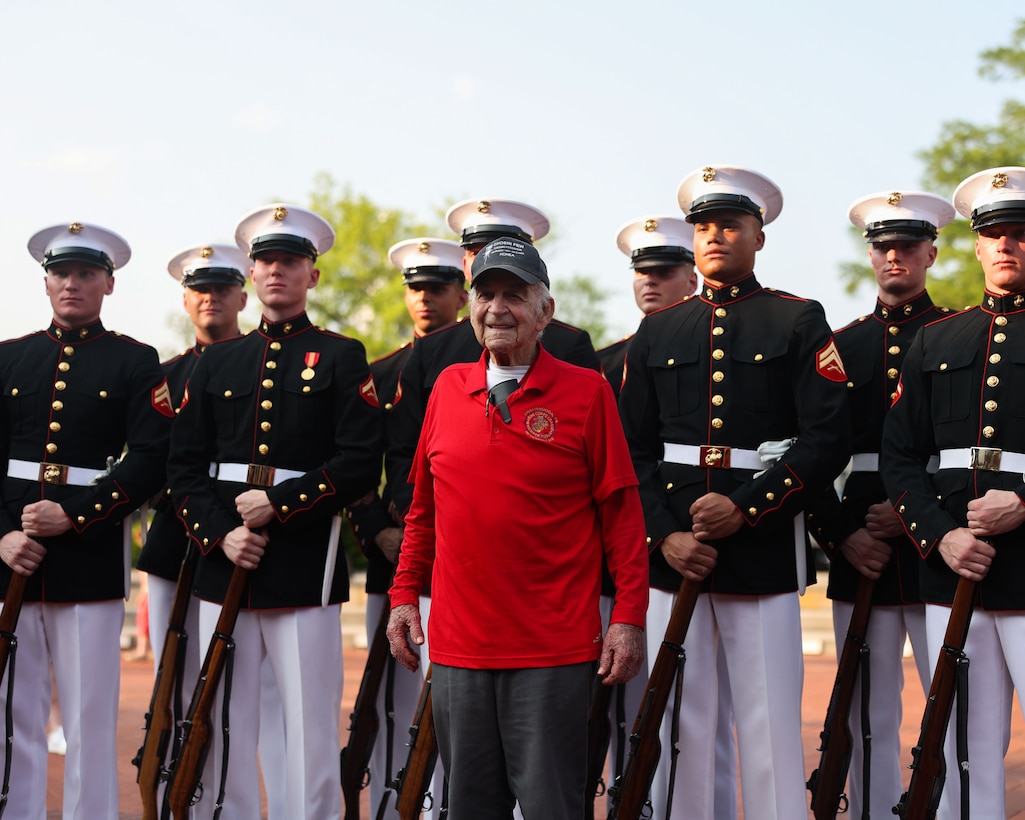 Retired U.S. Marine Corps veteran Sgt. William Parks stands with the U.S. Marine Corps Silent Drill Platoon during a Marine Week celebration in Nashville, Tenn., June 4, 2025. Parks, recognized as the oldest Marine in attendance, participated in the ceremony honoring the service and legacy of Marines past and present. Marine Week offers communities the opportunity to connect with Marines through performances, static displays, and community outreach. (U.S. Marine Corps photo by Lance Cpl. Brynn L. Bouchard)