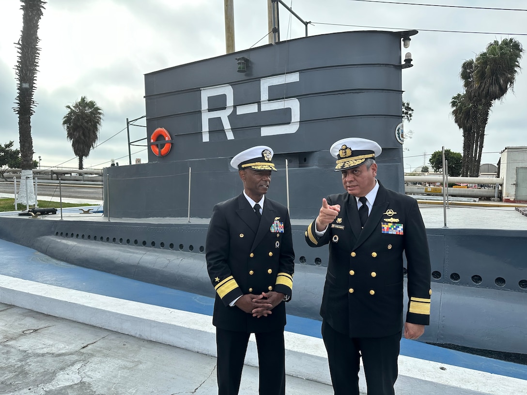 A Peruvian Read Admiral is pictured on the left standing next to a U.S. Rear Admiral.