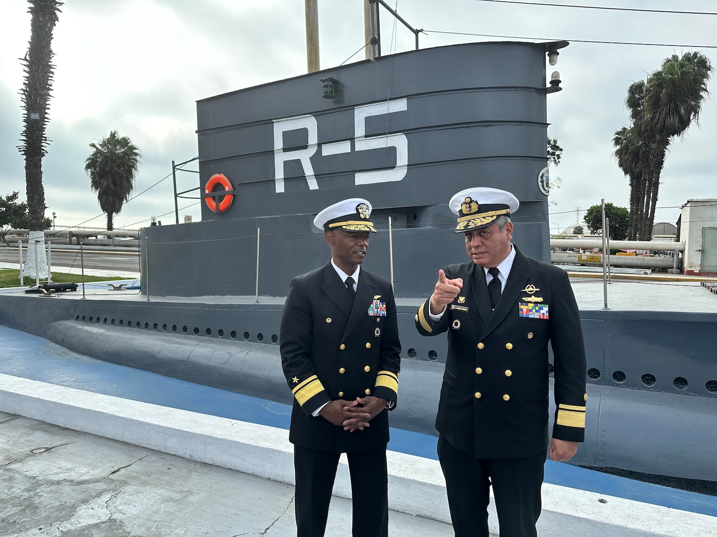 A Peruvian Read Admiral is pictured on the left standing next to a U.S. Rear Admiral.