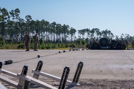 Airmen assigned to the 723d Combat Air Base Squadron operate an aircraft-arresting system at Tyndall Air Force Base, Fla., Sept. 15, 2025.