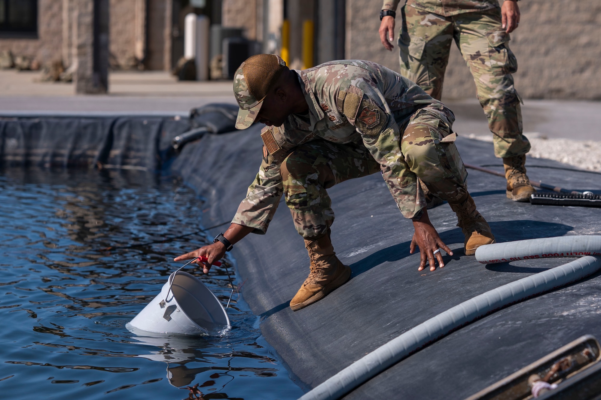 U.S. Air Force Chief Master Sgt. Anthony Thompson Jr., senior enlisted leader for Joint Base Anacostia-Bolling and the 11th Wing, pulls water for a training test at Tyndall Air Force Base, Fla., Sept. 15, 2025.