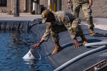 U.S. Air Force Chief Master Sgt. Anthony Thompson Jr., senior enlisted leader for Joint Base Anacostia-Bolling and the 11th Wing, pulls water for a training test at Tyndall Air Force Base, Fla., Sept. 15, 2025.