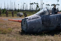 Airmen assigned to the 723d Combat Air Base Squadron operate a crash damage disabled aircraft device to clear a simulated aircraft crash from a runway at Tyndall Air Force Base, Fla., Sept. 15, 2025.