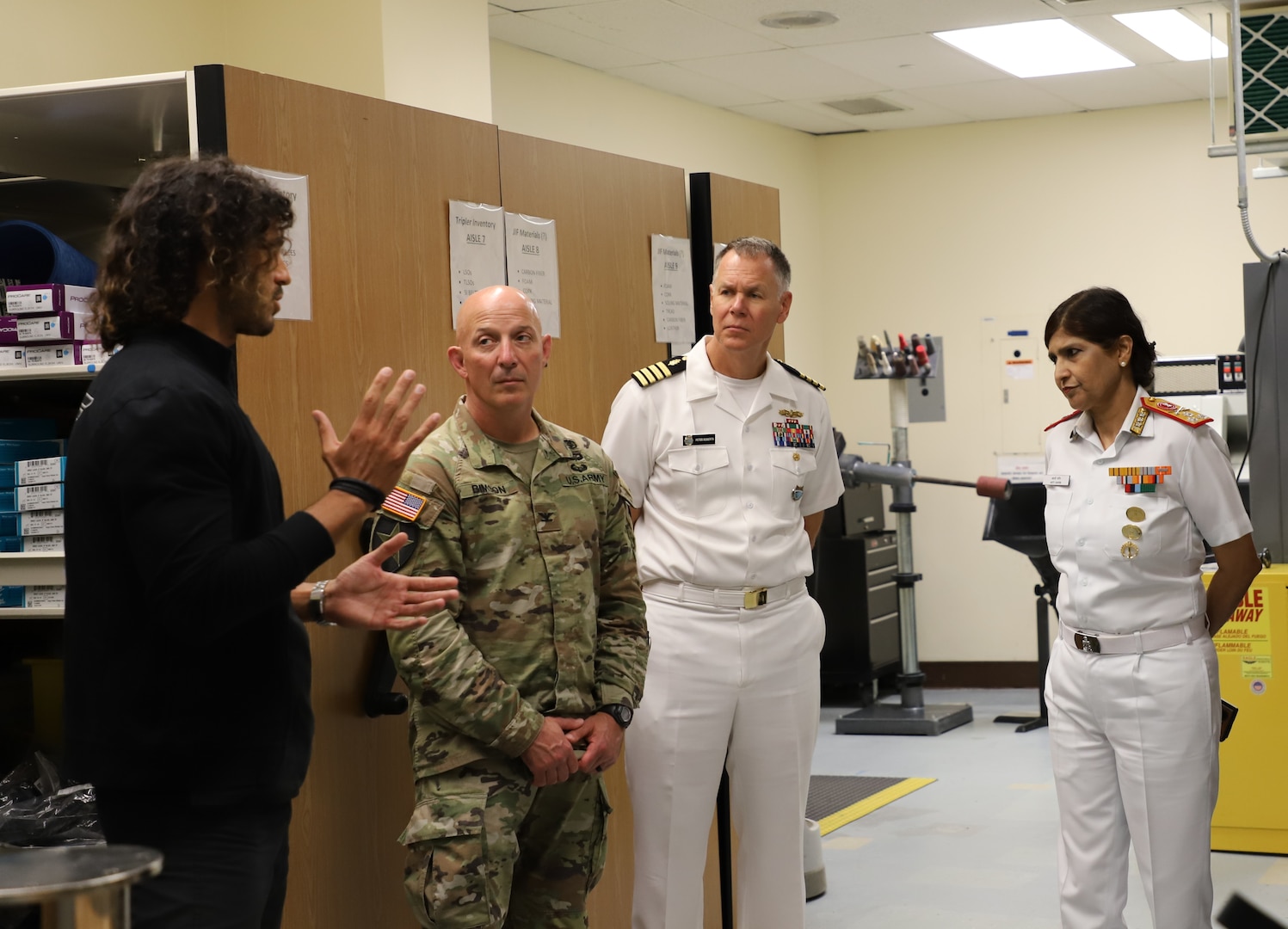 Stefano Poletta, chief of Orthotic and Prosthetics Services at Tripler Army Medical Center’s Brace Shop, speaks with senior leaders including U.S. Army Col. William Bimson, commander of Tripler Army Medical Center; U.S. Navy Capt. Peter Roberts, command surgeon for U.S. Indo-Pacific Command; and Indian Navy Vice Adm. Arti Sarin, Director General of the Armed Forces Medical Services on Sept. 18, 2025. (Defense Health Agency photo by Khinna Kaminske)