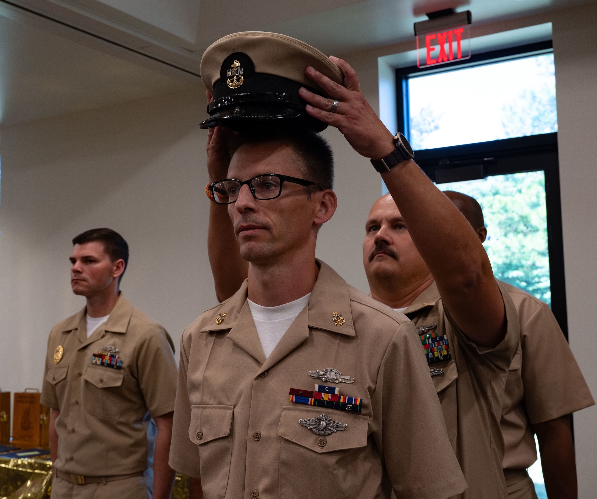 U.S. Navy Hospital Corpsman Chief Anders Hasseler, Navy Cargo Handling Battalion 8 medical chief, receives his combination cover during an annual Chief Petty Officer pinning ceremony at Joint Base McGuire-Dix-Lakehurst, N.J. Sept. 13, 2025. This time-honored tradition signified the shift in responsibilities for service members as they became subject matter experts to mentor junior enlisted service members.