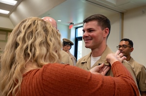 U.S. Navy Master-at-Arms Chief Brior Magee, Navy Cargo Handling Battalion 8 maintenance chief, receives his anchors during a Chief Petty Officer pinning ceremony at Joint Base McGuire-Dix-Lakehurst, N.J. Sept. 13, 2025. Once pinned, chiefs are given more responsibilities like mentoring junior enlisted service members and being the bridge between officers and enlisted personnel.