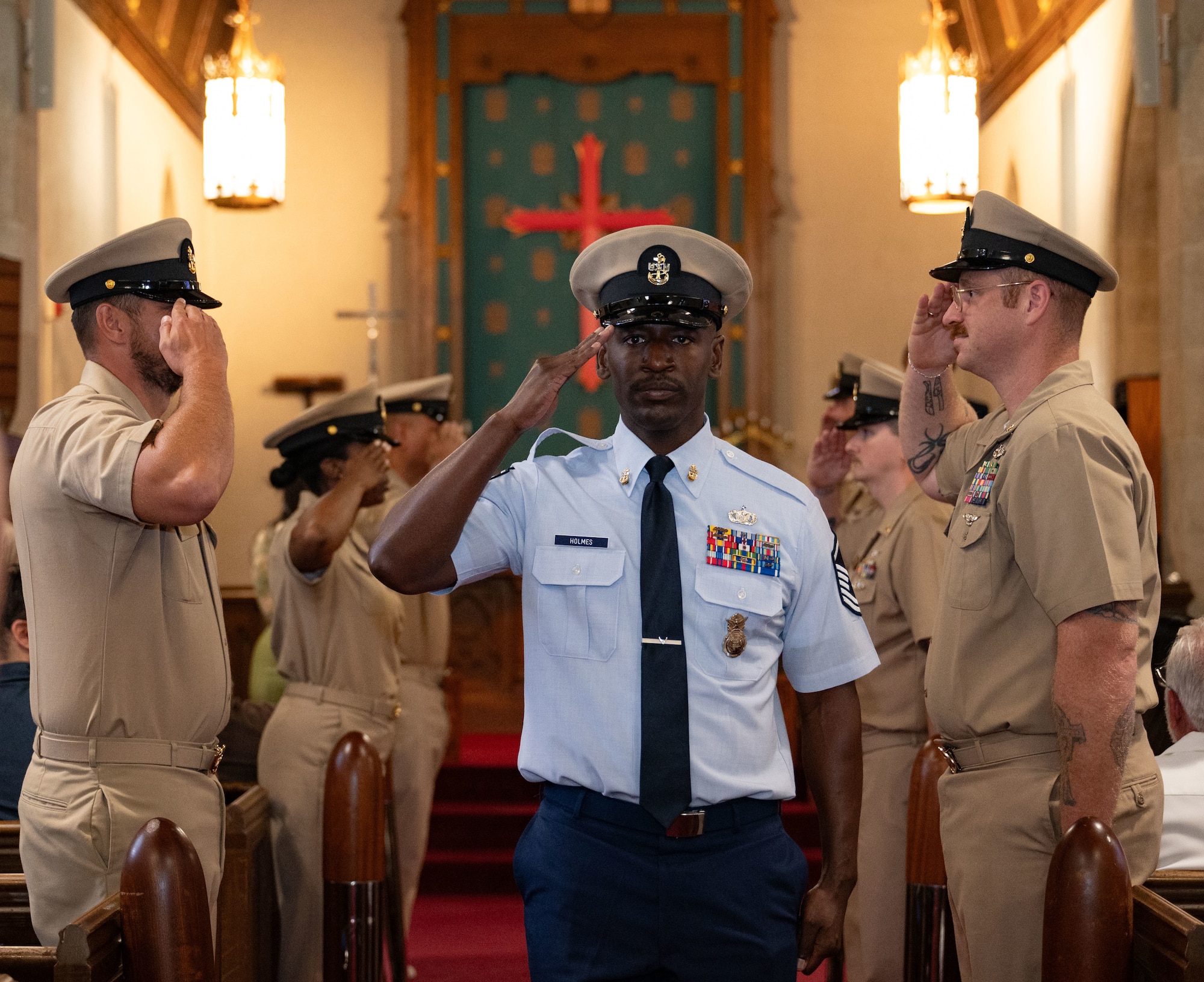 U.S. Air Force Master Sgt. Joshua Holmes, 87th Security Forces Squadron confinement noncommissioned officer in charge, receives salutes from other chiefs to symbolize his entry into the Chiefs Mess during a Chief Petty Officer pinning ceremony at Joint Base McGuire-Dix-Lakehurst, N.J. Sept. 16, 2025. The salute signified being “welcomed aboard” and taking on the new, demanding responsibilities of being a chief.