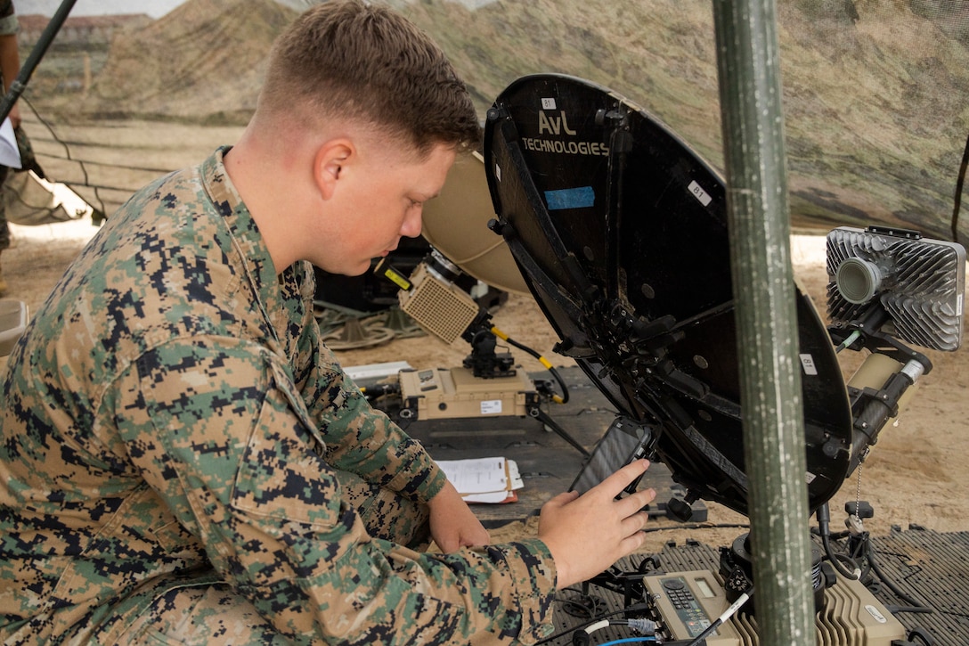 U.S. Marine Corps Cpl. Treyton Cronk, a satellite transmissions systems operator with 9th Communication Battalion, I Marine Expeditionary Force Information Group, establishes services for an expeditionary network by using a ViaSat Multi-Mission Terminal during a sustainment exercise at Marine Corps Base Camp Pendleton, California, Aug. 14, 2025.