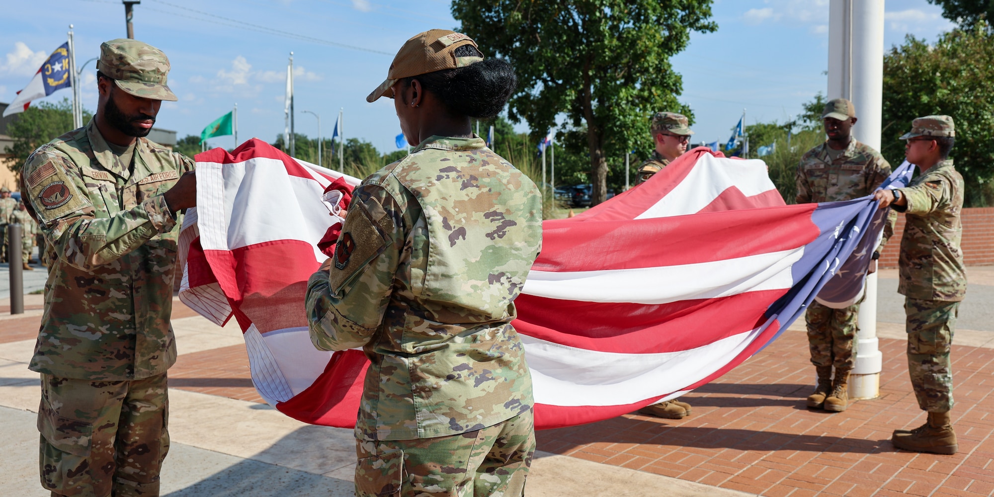 Airmen fold the American flag during the annual POW/MIA retreat ceremony at Sheppard Air Force Base, Texas, September 19th, 2025. The ceremony honored prisoners of war and those still missing in action.