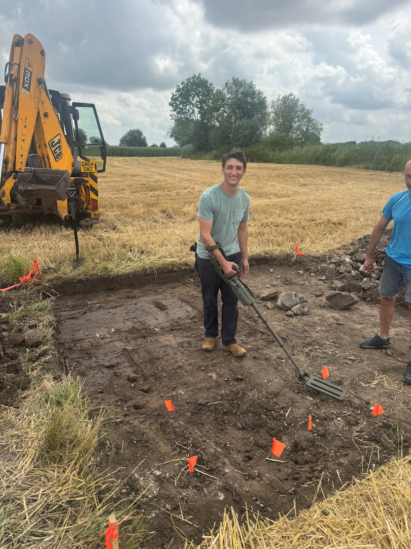 Zachariah Ellwanger, an Army ROTC cadet from the University of Arizona shovels dirt in Poland, July 26, 2025.