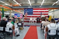 Capt. Michael Dolbec, commander, Unmanned Undersea Vehicle Group (UUVGRU) 1, unveils the command’s new logo during a change of command ceremony at Naval Base Kitsap-Keyport, Wash., June 14, 2024. During the ceremony, Dolbec relieved Capt. Jason Geddes as commander, UUVGRU 1. (U.S. Navy photo by Mass Communication Specialist 2nd Class Victoria Galbraith)