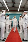 Capt. Michael Dolbec passes sideboys during the change of command ceremony for Unmanned Undersea Vehicle Group (UUVGRU) 1 at Naval Base Kitsap-Keyport, Wash., June 14, 2024. During the ceremony, Dolbec relieved Capt. Jason Geddes as commander, UUVGRU 1. (U.S. Navy photo by Mass Communication Specialist 2nd Class Victoria Galbraith)