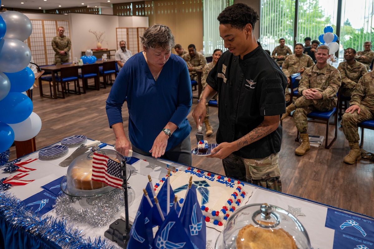 Members at Misawa Air Base cut a cake during a 78th Air Force birthday celebration at Misawa Air Base, Japan, Sept. 18, 2025.