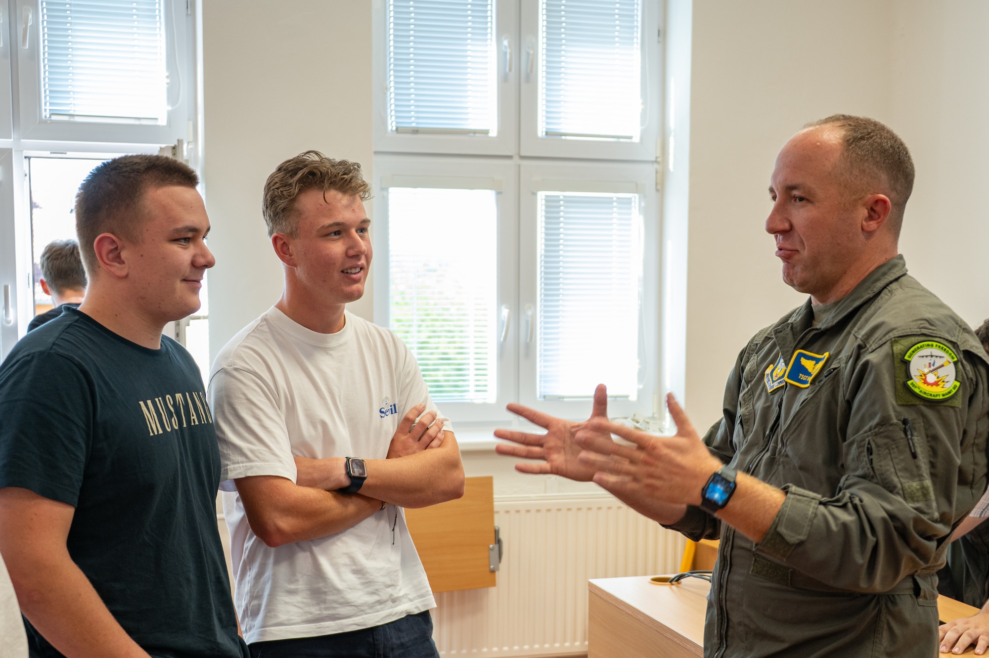 U.S. Air Force Master Sgt. Christopher Bankson, 307th Bomb Wing avionics specialist, talks to students about his experiences in the military at a local school in Ostrava, Czech Republic, Sept. 19, 2025. These visits strengthen community ties with NATO Allies and partners and coincide with the NATO Days air show in Ostrava, Czech Republic. (U.S. Air Force photo by Capt. Cody Burt)