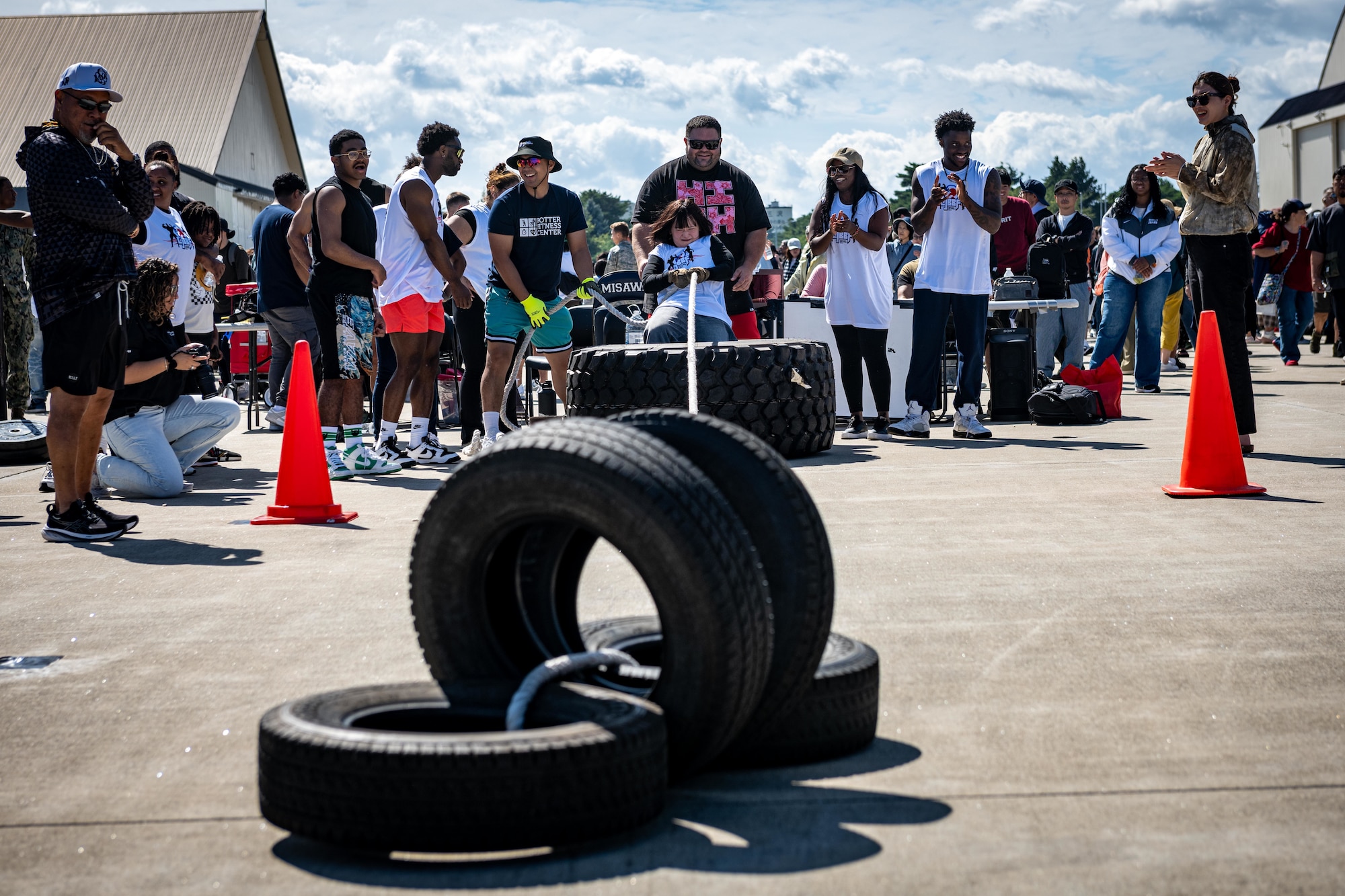 A strongman competition participant pulls four tires during Air Fest 2025.