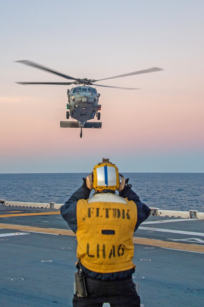 An MH-60S Seahawk from Helicopter Sea Combat Squadron (HSC) 25 prepares to land on the flight deck of the forward-deployed amphibious assault ship USS America (LHA 6) while conducting flight operations in the Coral Sea, July 1. America, lead ship of the America Amphibious Ready Group, is operating in the U.S. 7th Fleet area of operations. U.S. 7th Fleet is the U.S. Navy’s largest forward-deployed numbered fleet, and routinely interacts and operates with allies and partners in preserving a free and open Indo-Pacific region.